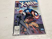 Front cover of The Uncanny X-Men comic issue #266 featuring Captain America, Wolverine, and Black Widow