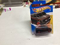 Photo of unopened 2010 Hot Wheels A Team van in original packaging, showing front and side of blister card and van.