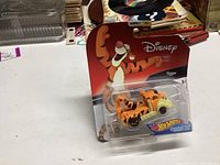 Photo showing unopened Hot Wheels Disney Tigger character car in original blister pack with Disney and Hot Wheels branding.