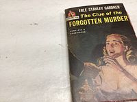 Photo of the front cover of the paperback book 'The Clue of the Forgotten Murder' by Erle Stanley Gardner, showing the artwork and title clearly.