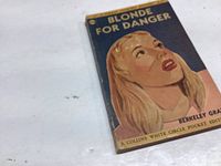 Photo showing the front cover of the paperback book titled 'Blonde For Danger' by Berkeley Gray, with illustrated cover art of a blonde woman.