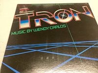 Front cover of the Tron soundtrack vinyl with the title and music credits to Wendy Carlos.