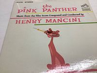 Front cover of The Pink Panther OST vinyl record featuring Pink Panther cartoon and Henry Mancini credits.