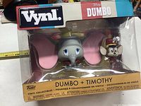 Boxed Funko Vynl Disney Dumbo and Timothy vinyl collectible figures, unopened in original packaging, showing clear front window and branding.