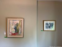 Both artworks hanging on the wall showing size proportion and framing.