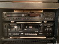 Front view of Toshiba CD player XR-9037 on top and Toshiba stereo cassette deck PC-5827 below with included user manuals.