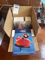 Open box showing the Xpress Redi Set Go appliance and its original packaging inside Styrofoam blocks.