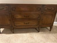 Front and angled view of the 1960s wooden server showing drawers, cupboards, hardware, and upper surface.
