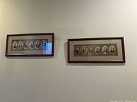 Two framed wall art prints hanging side by side on a light wall, each featuring multiple sepia-tone portraits in oval frames within the print.