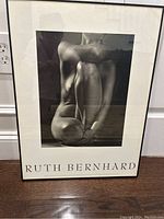 Framed black and white nude photograph by Ruth Bernhard, showing full piece including frame and matting.