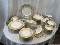 Full set arrangement with large plates, bowls, cups, saucers