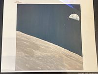 Full view of print showing lunar surface and Earthrise