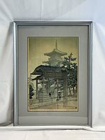 Full view of framed print showing metal frame, mat, glass and artwork.