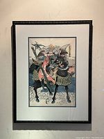 Full view of framed print hung on wall