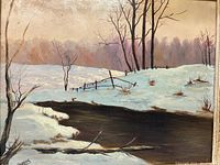 Full frontal view of the oil on board painting in its gilt wood frame showing a snow-covered field, stream, and trees.