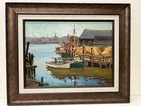 Frontal view of framed oil on board painting showing harbor scene