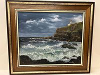 Frontal image showing the entire oil on board painting in frame, depicting the seascape with lighthouse and crashing waves.