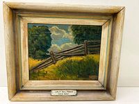 Overall view of framed painting showing subject, frame and plaque