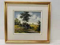 Framed oil painting showing entire artwork with wide off-white mat and gold wooden frame