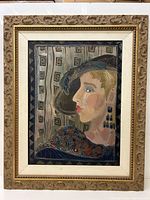 Frontal view of the oil on board portrait in ornate carved gilt frame