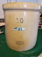 Full view of 10 gallon stoneware crock with stamped number "10" and Medalta Stoneware LTD oval mark near the base