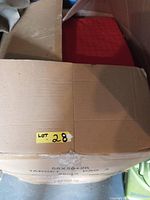 Closed cardboard box labeled with lot number '28' and container dimensions '58X50X20'.