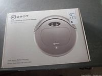 Box of Kobot Slim Series robot vacuum cleaner showing brand and model info.