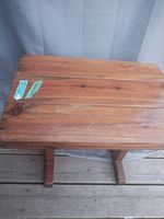 Top view of wooden table showing natural wood board surface and grain details.