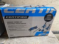 Box of Certified 2 Tonne Garage Combo Kit showing brand, capacity, and contents including trolley jack and axle jacks