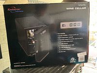 Koolatron 6-bottle wine cellar boxed showing product image, features, and basic specs.