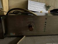 Front view of Fostex power amplifier with volume knob and LED indicators.