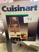 Box of Cuisinart Classic Food Processor showing branding and maximum capacity of 7 cups (1.75 L).