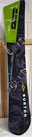 Full snowboard with bindings showing overall design and condition