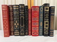 Photo of 10 leather bound books from the Franklin Library with decorative gold embossed spines, showing titles and authors.