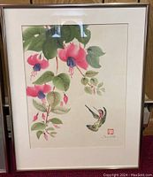 Full view of the framed and matted floral and hummingbird artwork signed Toyota with red seal stamp.