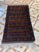 Full view of the Persian rug showing overall pattern and size relative to floor.