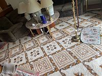 Room view showing large 10x10 vintage Mid-Century Modern style area rug under coffee table and lamps, featuring geometric diamond pattern in mustard yellow, brown, and white.