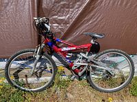 Full side view of Carrera Hawkeye mountain bike showing overall frame and components.