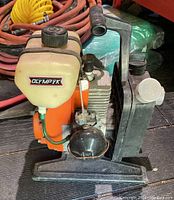 Side view showing the whole gas water pump including fuel tank, motor, and pump assembly.