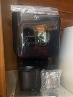 Front and side views of Levo II Jet oil infuser, showing control panel and logo.