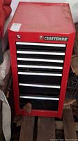 Front view of closed tool chest showing Craftsman logo and top lock