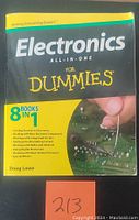 Front cover of the book showing the title 'Electronics All-in-One For Dummies' and author Doug Lowe, highlighting 8 books in one collection.