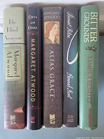 Books upright showing spines with titles and author names for identification.