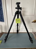 Full view of Manfrotto tripod set up, showing tripod legs and head.