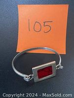 Front view of the Mexican sterling silver bracelet with red jasper stone and orange tag number 105