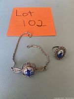 Photo showing the vintage bracelet and ring with blue Delft windmill ceramic pieces on silver settings.
