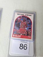 Front of 1989 NBA Hoops Michael Jordan basketball card in plastic sleeve showing player in Chicago Bulls uniform with number 23.