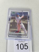 Front side of Bobby Witt Jr. baseball card showing player batting in Kansas City Royals uniform, card protected in clear plastic sleeve.