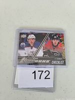 Front of hockey card showing Connor McDavid and Sam Bennett Young Guns Checklist