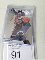 Front of Ja Morant rookie basketball card in protective sleeve showcasing player image and NBA Debut design.